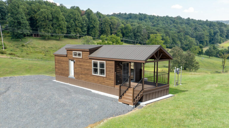 pinecone cabin by dwellity with wood siding