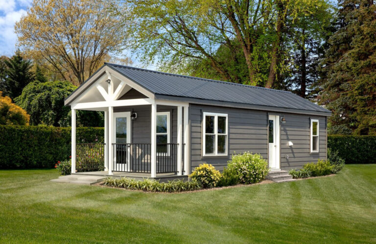 the white river lodge by Dwellity in a yard with trees behind