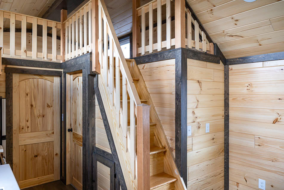 stairs to loft with standard wood railing