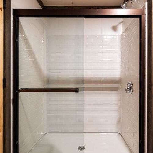 full shower with sliding glass doors