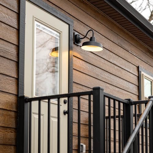 outside door with hand railing and light