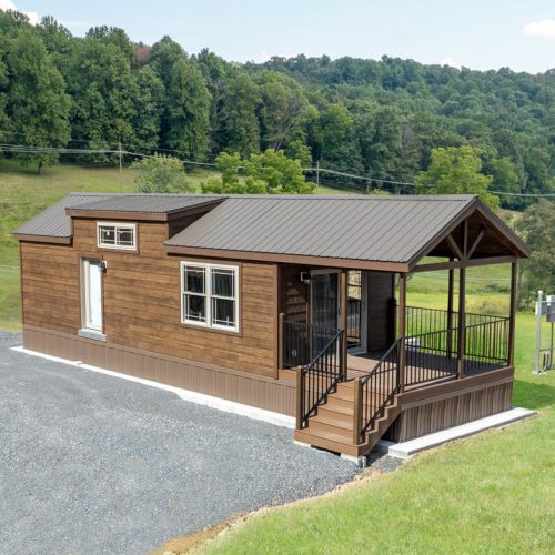 pinecone cabin by dwellity with wood siding