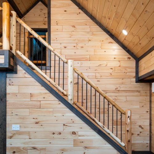 Cedar Ridge Lodge Stairs to Loft with Log Hand Railing and Round Iron Balusters